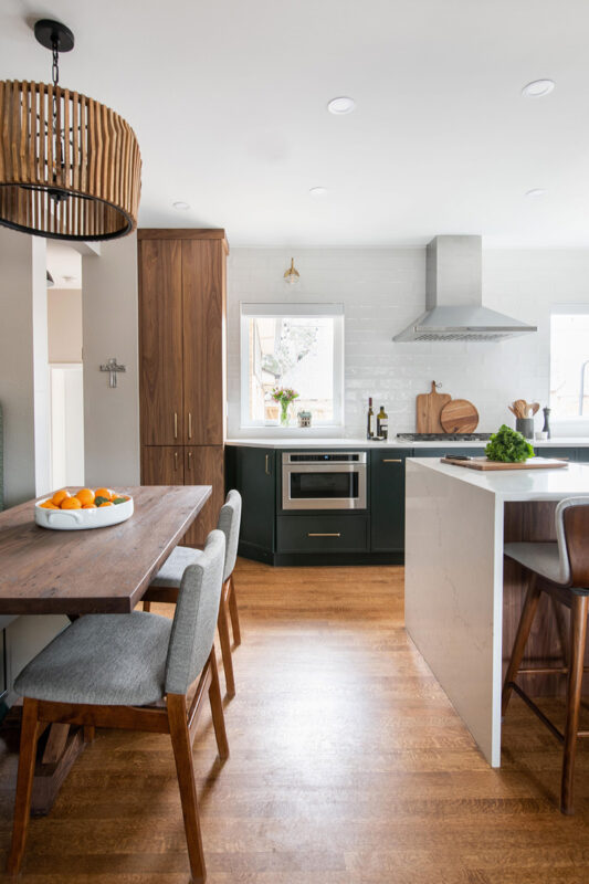 Stained and painted open floor plan kitchen with island