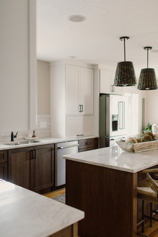 Painted and stained kitchen cabinets, including island.