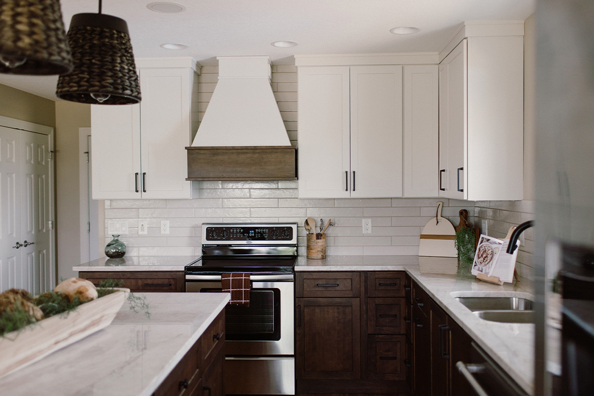 Painted and stained kitchen cabinets, including island.