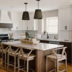 Painted and stained kitchen cabinets, including island.