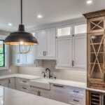 Stained and painted kitchen cabinets with glass and mullion glass doors