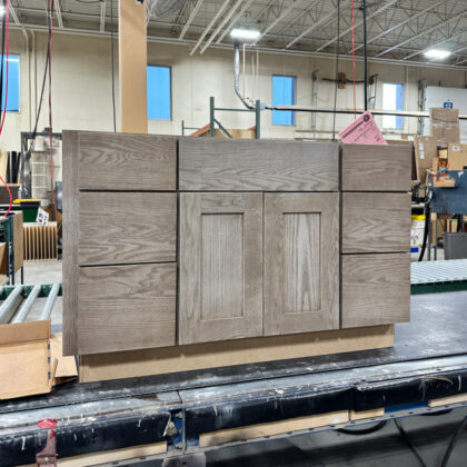 Vanity cabinet with sink space and drawer stacks on left and right side. Stained with Montana finish.