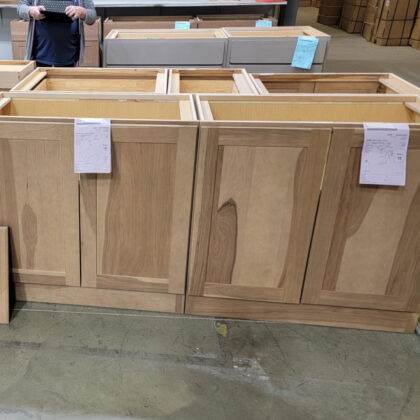 Base cabinets in warehouse area in hickory finished with Sable stain.