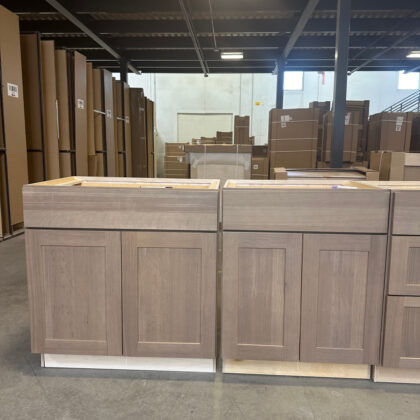 Base cabinets in a warehouse area in quartersawn white oak finished with the Sparrow stain.