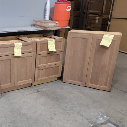 Cabinets in a warehouse area in rift white oak finished with Sable stain.