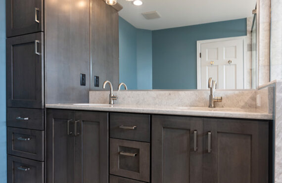 Stained bathroom vanity and mirror