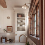 Small painted kitchen next to a window