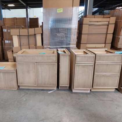 Stained maple base cabinets in a warehouse area