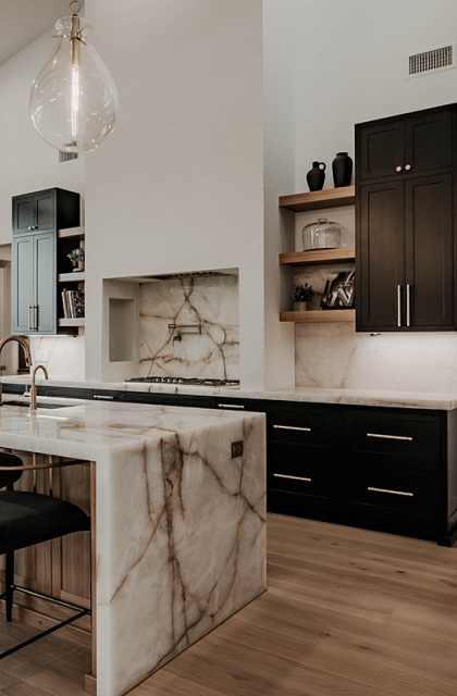 stained and painted kitchen with large white hood over cooktop