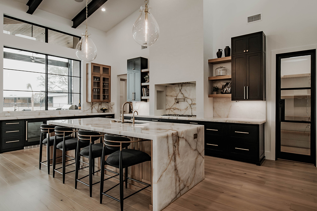 Painted and stained large open kitchen with beams on ceiling