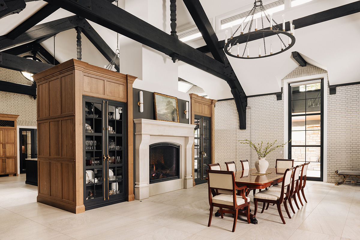 Large open kitchen space with wood beams and stained and painted cabinets