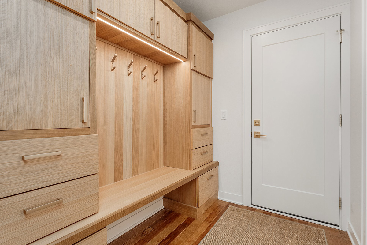 Stained mudroom bench and locker cabinets