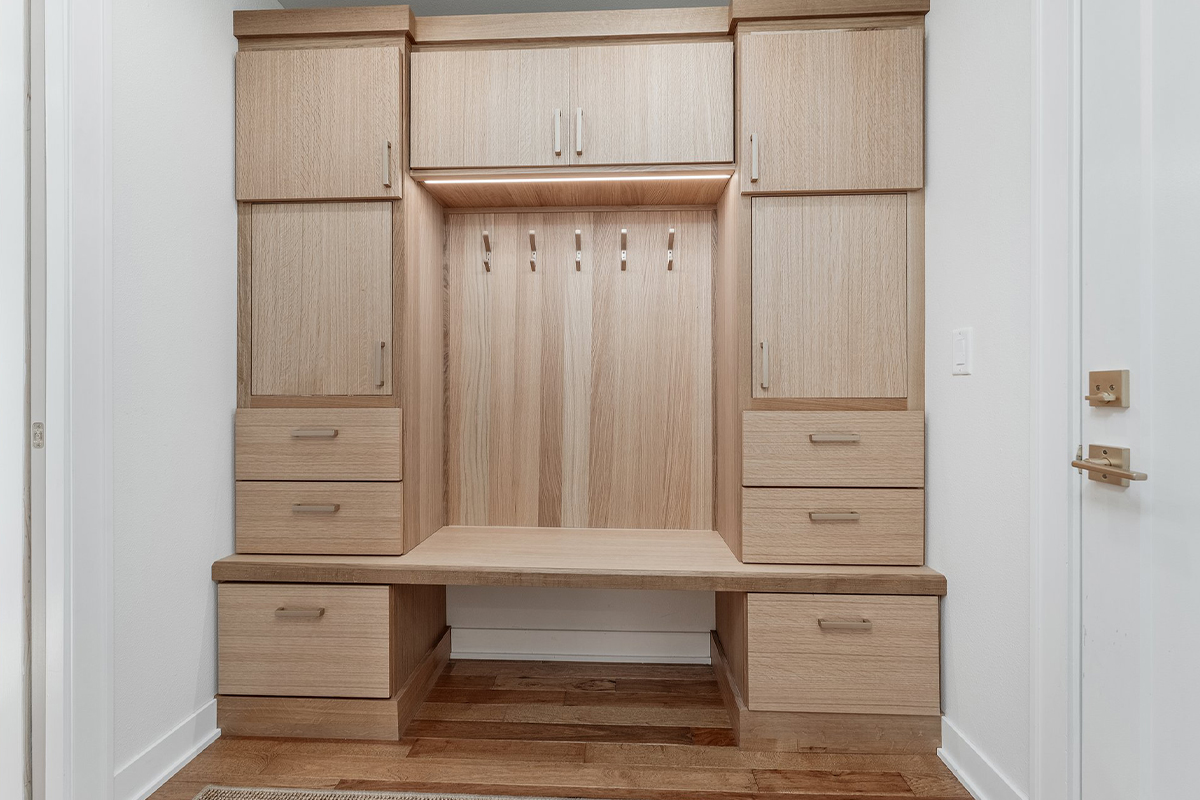 Stained mudroom bench and locker cabinets