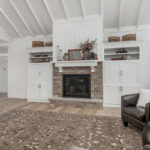 Painted living room cabinets surrounding fireplace