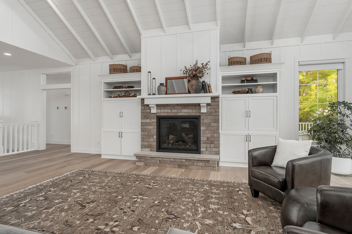 Painted living room cabinets surrounding fireplace