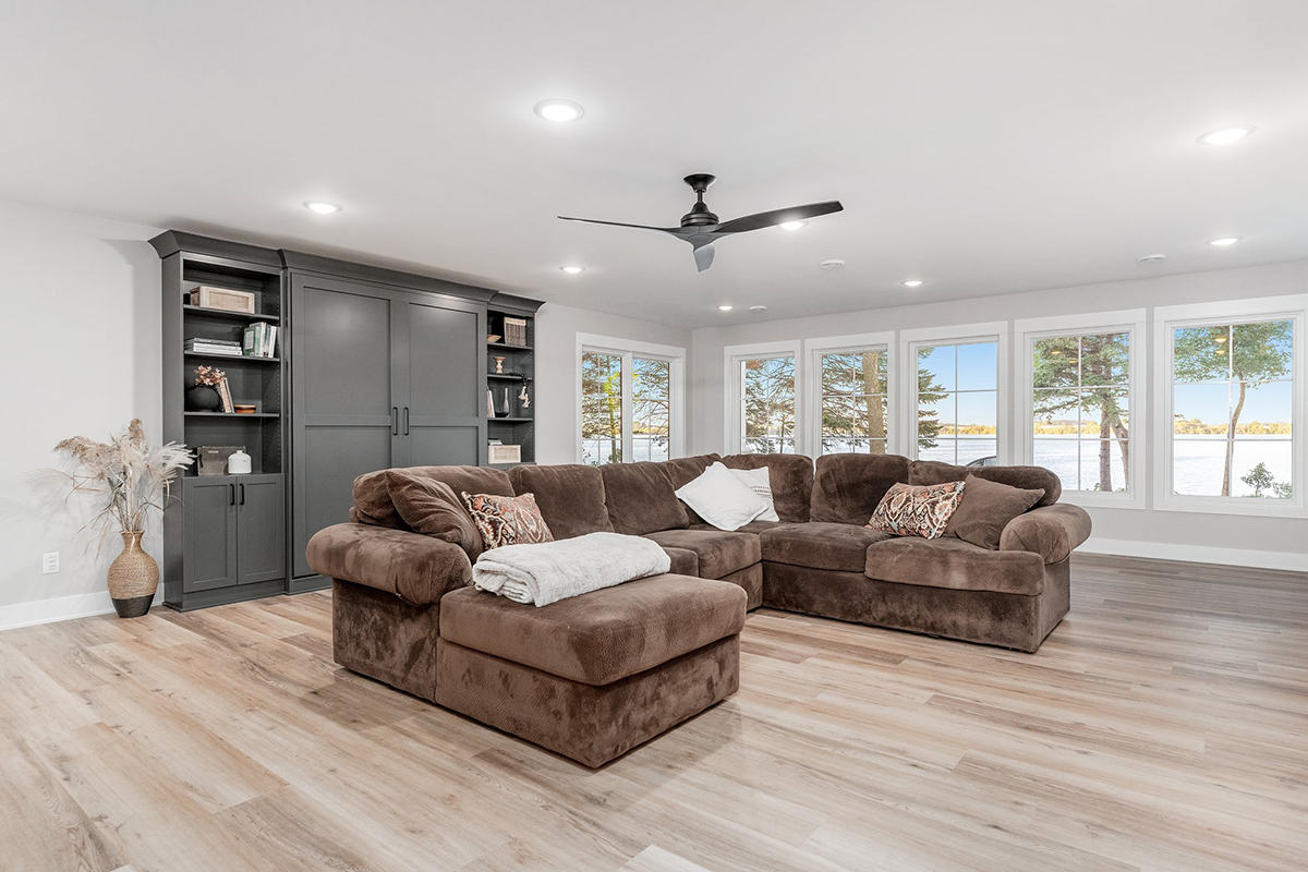 Painted bookcase cabinets with a sectional couch