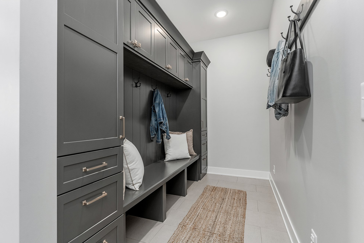 Painted mudroom locker cabinets and bench seating