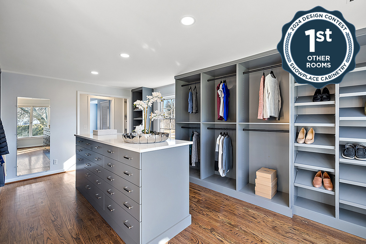 Painted walk-in closet cabinets with hanging closes and a center island for additional storage