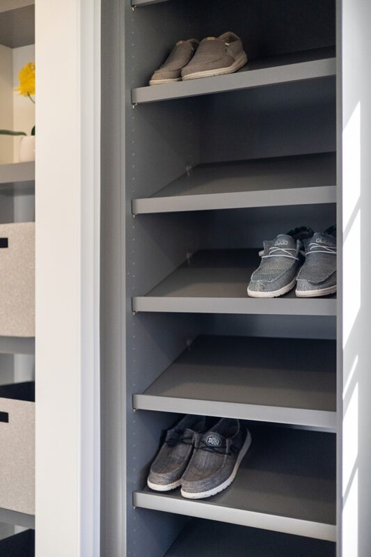 Painted walk-in closet cabinets with shoe storage