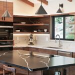 Walnut natural contemporary kitchen with vaulted ceiling and wood beams