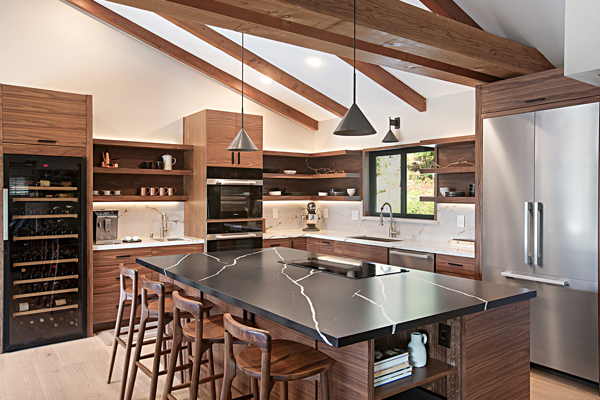 Walnut natural contemporary kitchen with vaulted ceiling and wood beams