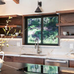 Walnut natural contemporary kitchen with vaulted ceiling and wood beams