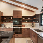 Walnut natural contemporary kitchen with vaulted ceiling and wood beams