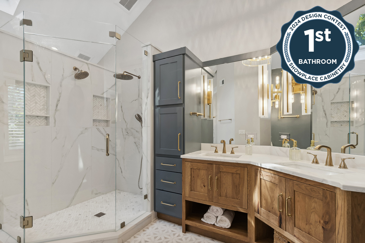 Master bathroom with stained vanity cabinets and painted tall linen cabinets. Also includes a shower with glass walls.