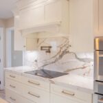 Soft cream painted kitchen cabinets