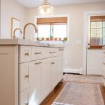 Soft cream painted kitchen cabinets