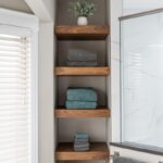 linen storage showing stained shelves holding towels