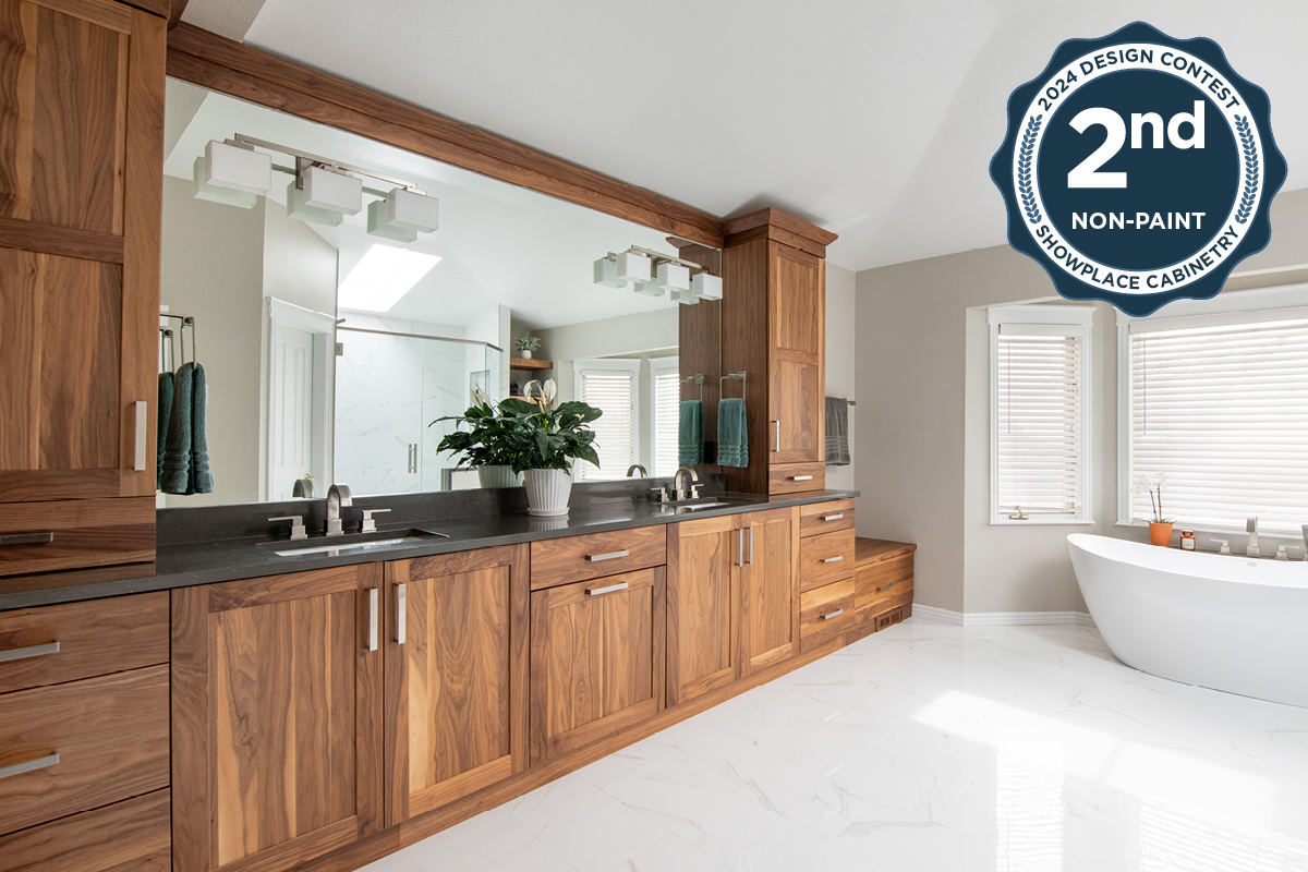 Walnut bathroom cabinets with 2 sinks and countertop storage on each end.