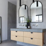 Contemporary bath with a floating vanity in stained oak