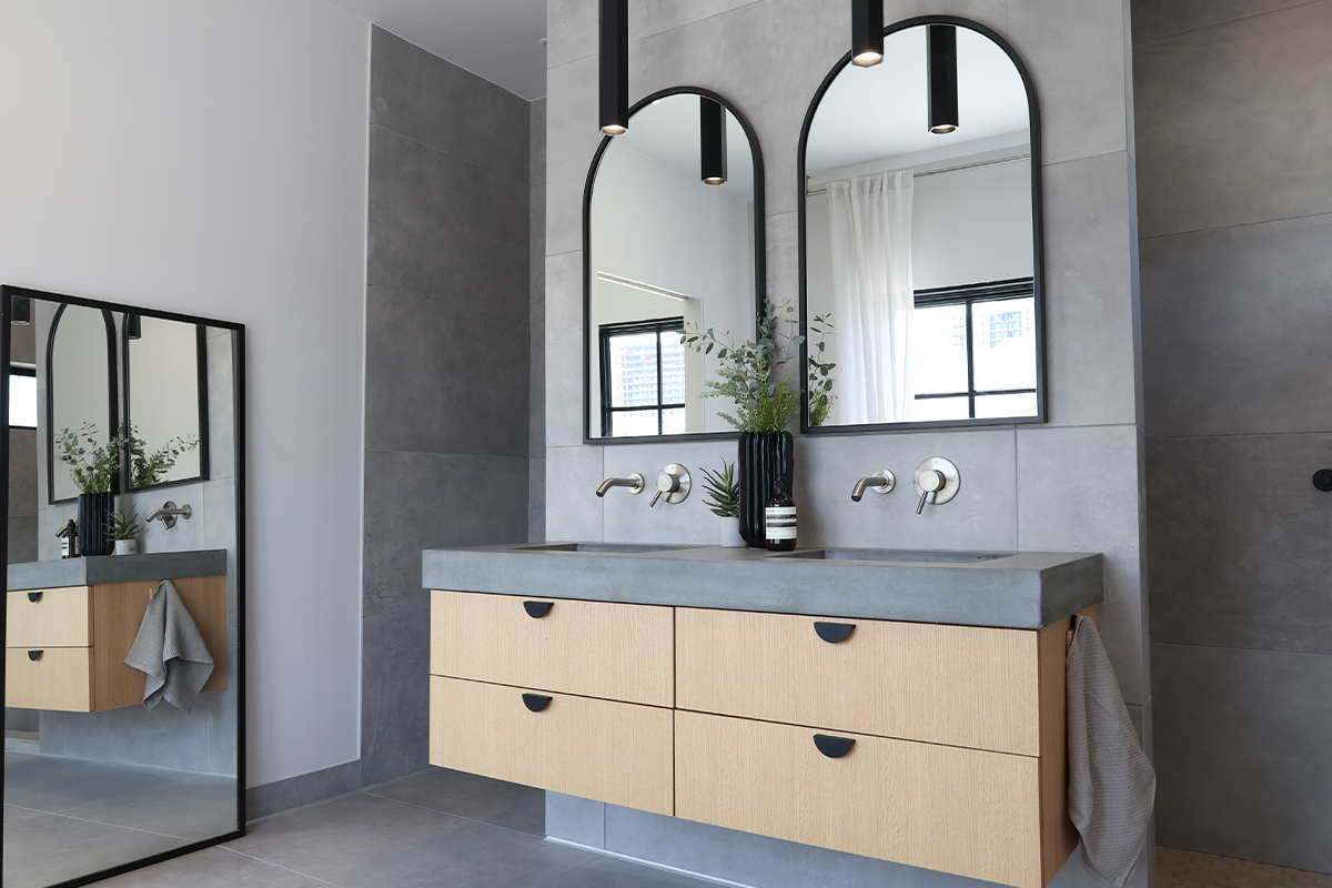 Contemporary bath with a floating vanity in stained oak
