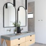 Contemporary bath with a floating vanity in stained oak