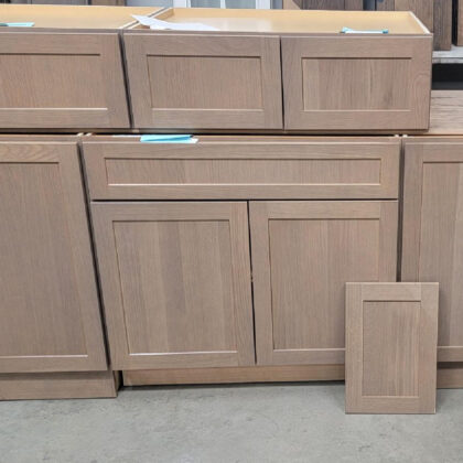Wall and base cabinets in a warehouse setting. Finished with Sparrow stain on Rift White Oak.