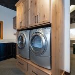 Painted and stained laundry room cabinet display