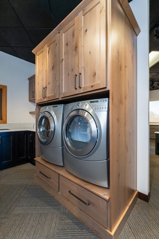 Painted and stained laundry room cabinet display