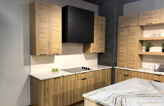 Ginger textured melamine cabinets on each side of a painted black box hood