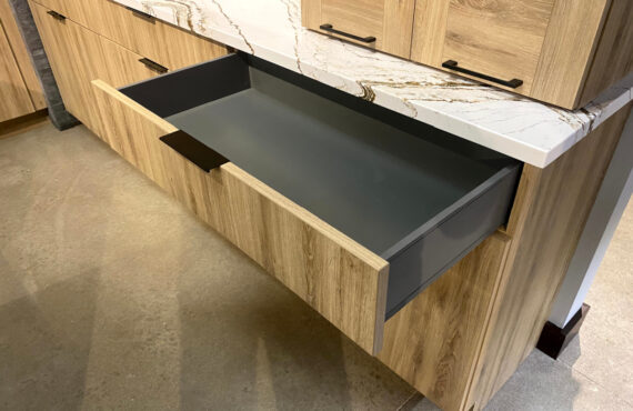 Base cabinet with metal drawer