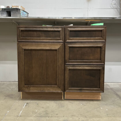 Base cabinets in a warehouse setting finished with Kona stain