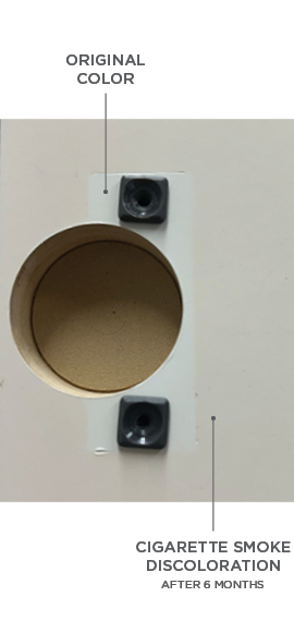 Cigarette smoke discoloration on the back side of a cabinet door. The hinge was removed to show the original paint color that was protected by the hinge.