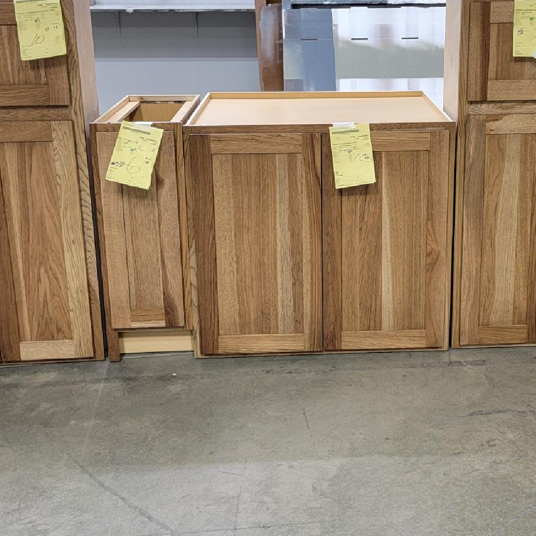Base cabinets in a warehouse area finished with Cashew stain on hickory