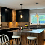 Kitchen with black painted and rustic natural cabinets