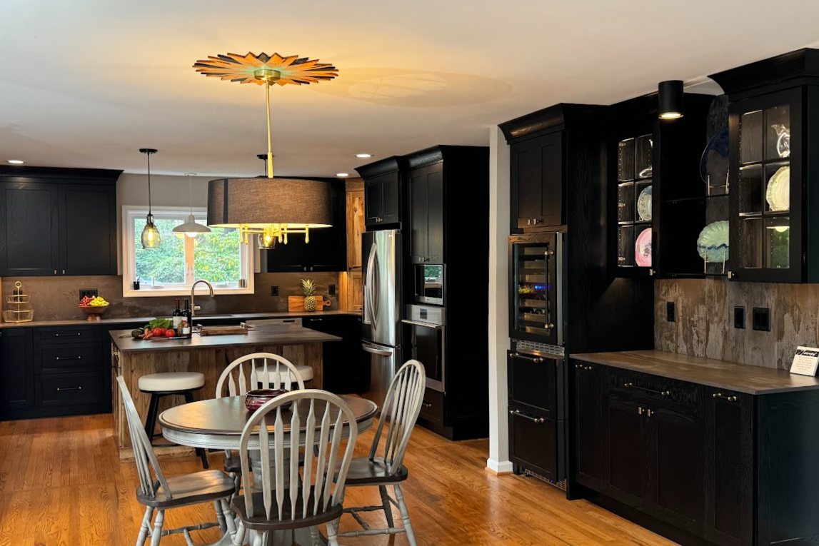 Kitchen with black painted and rustic natural cabinets