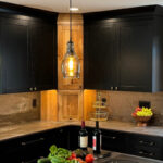 Kitchen with black painted and rustic natural cabinets