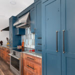Painted blue and walnut Natural kitchen cabinets