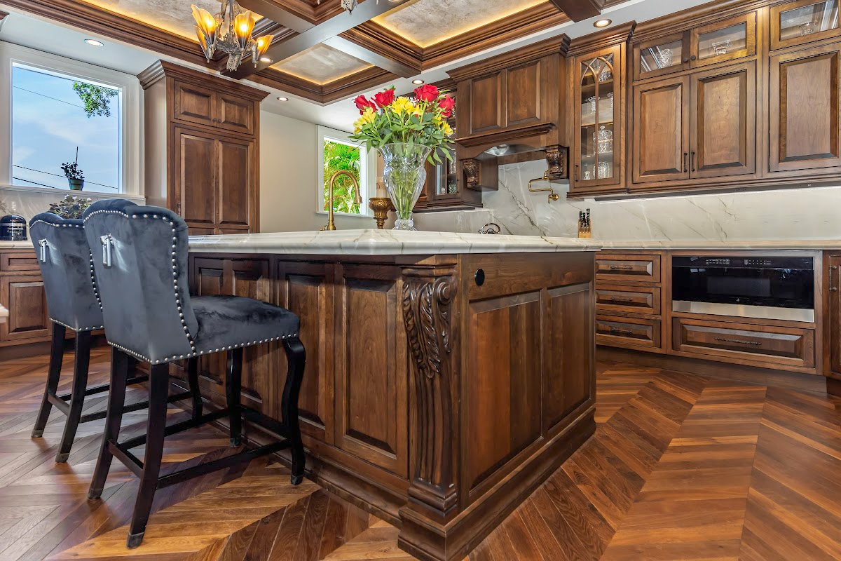 Traditional cherry kitchen cabinets with decorative elements.