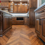 Traditional cherry kitchen cabinets with decorative elements.