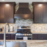 Dark stained kitchen cabinets in a galley kitchen space